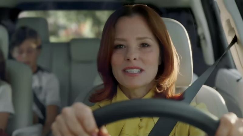 Parker Posey driving the Palisade Hybrid